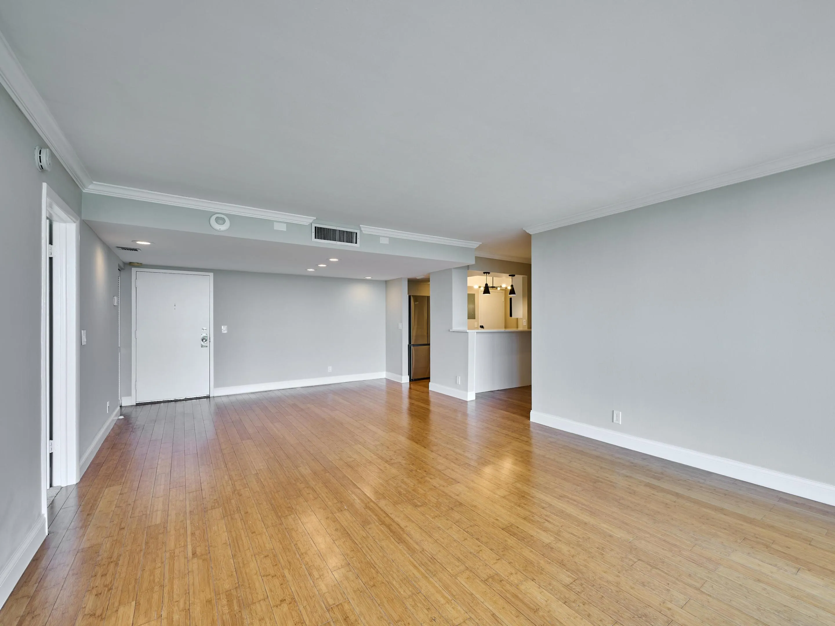Bamboo floors lend warmth to the condo.