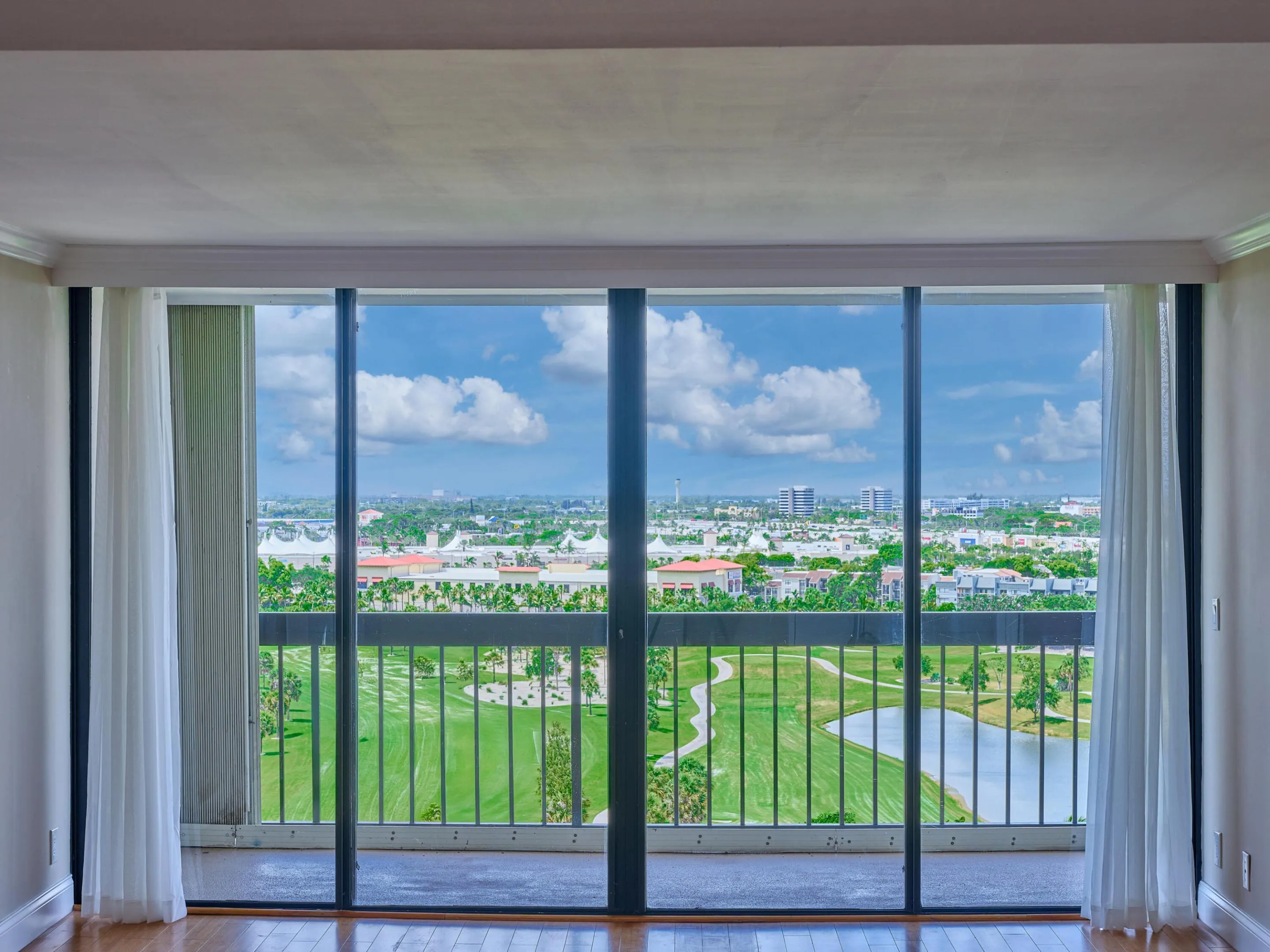 The panoramic Golf Course view from the 14th floor living room.