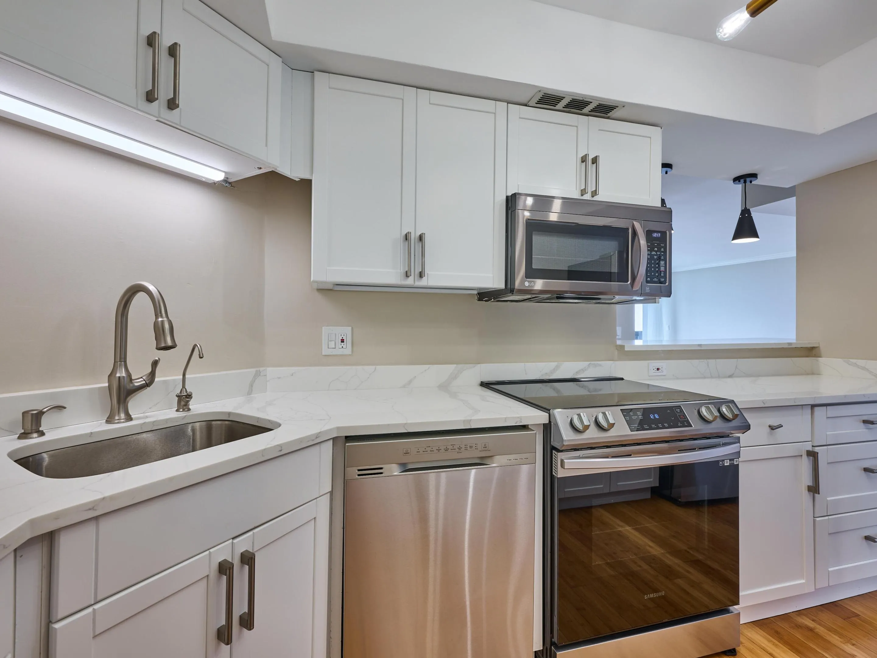 The breakfast bar invites friends to be part of the cooking fun and invites natural light into the kitchen.