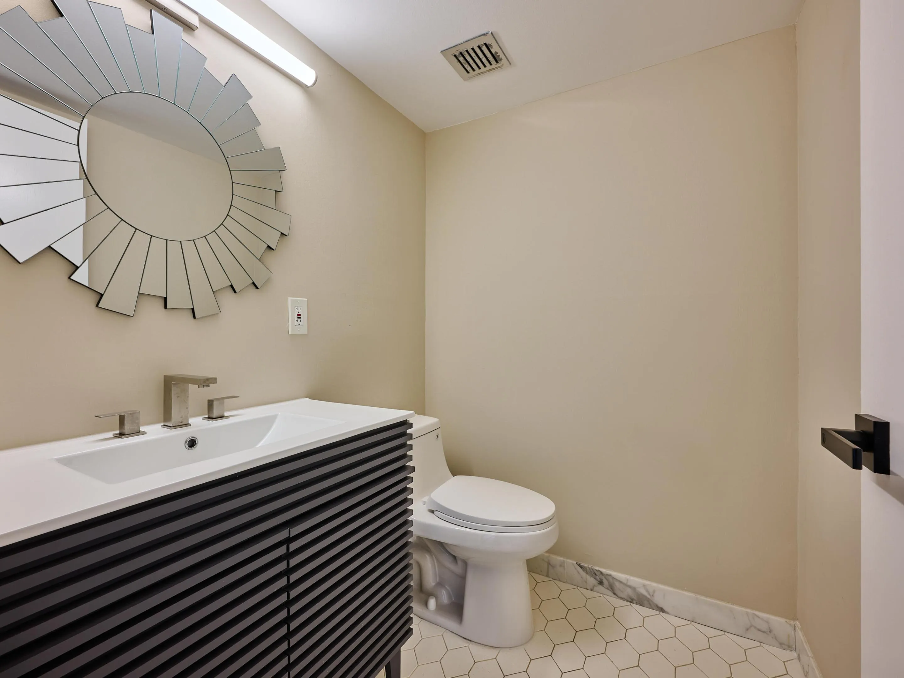 A generous half bath means guests never need to be in your private space.