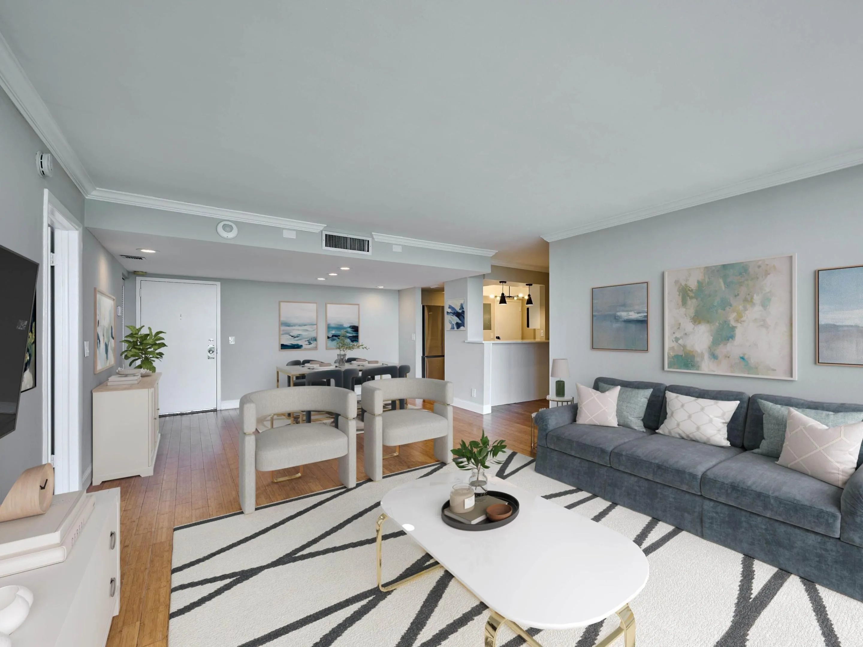 This great room + kitchen is perfect for entertaining and flows right out to the balcony.