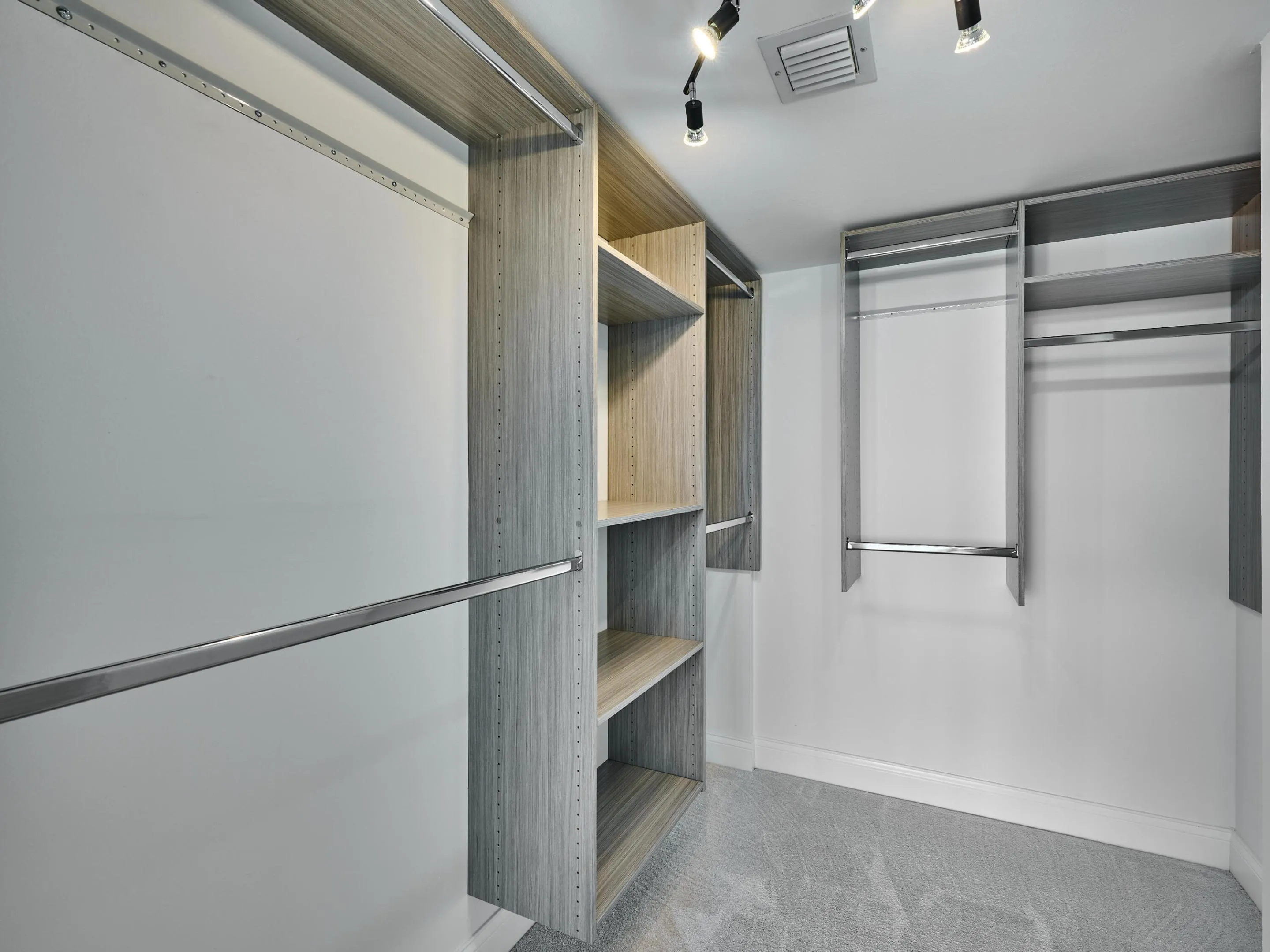 The built-out, walk-in closet keeps all of your clothes well organized.
