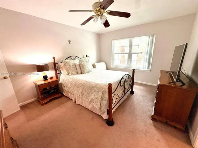 Primary bedroom with vaulted ceilings