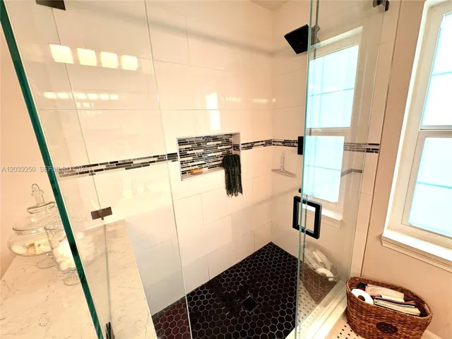 Gorgeous shower with thoughtfully designed integrated shelving