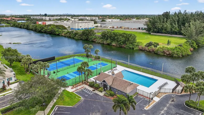 Aerial view of main pool, courts, and clubhouse area