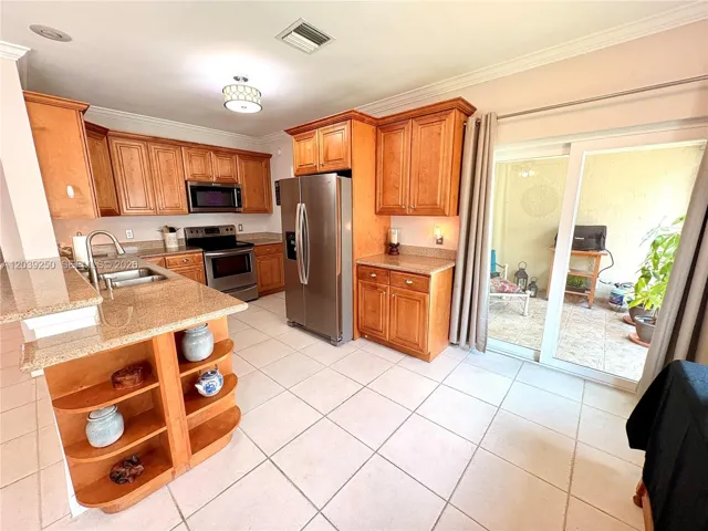 Convenient sliding doors out to covered screened patio