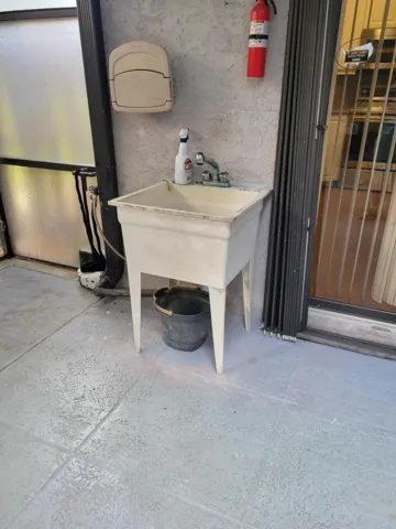 Large Deep sink for cleaning your hands outside or for washing larger items to hang and air dry as needed. Also, for gardening as well.