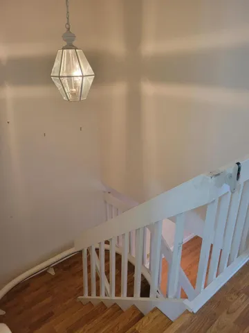 Tall ceiling as you ascend the stairs to the landing. Lots of places to hang photos etc.