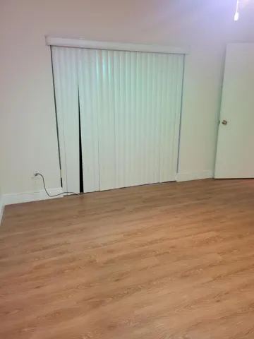 Bedroom has its own sliding glass door to the huge screened in porch.