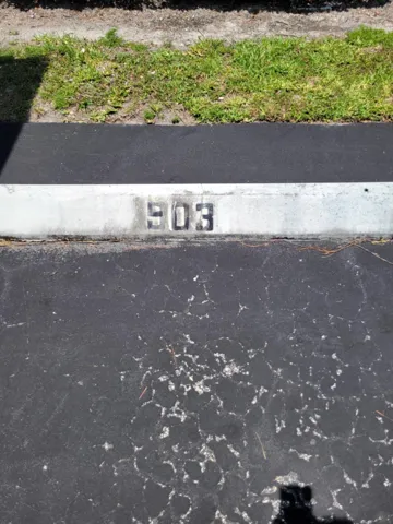 903 has 1 covered parking spot as well as one in the open area.