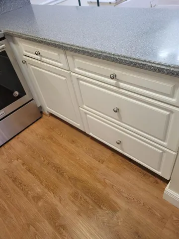 Large deep drawers open to hold all of your pots and pans, lids etc. No more standing on your head to pull them out.