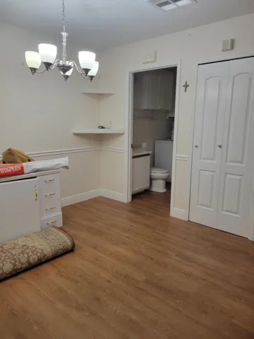 Dining room can accommodate a medium sized table with 6 chairs you can see the half bath and the laundry room just to rear of the photo.