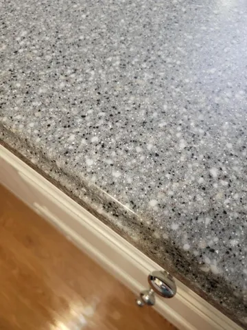 showing a closer view of the Corian counter tops
