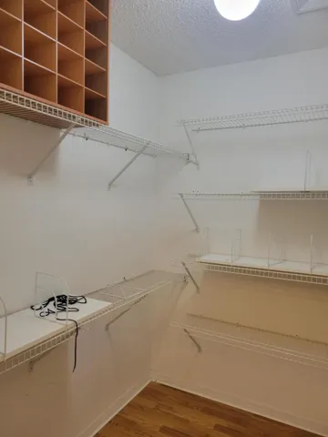 Note all the cubbies and shelves. This closet does double duty and then some.