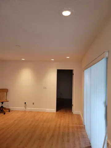 Looking toward third bedroom beyond the doorway.