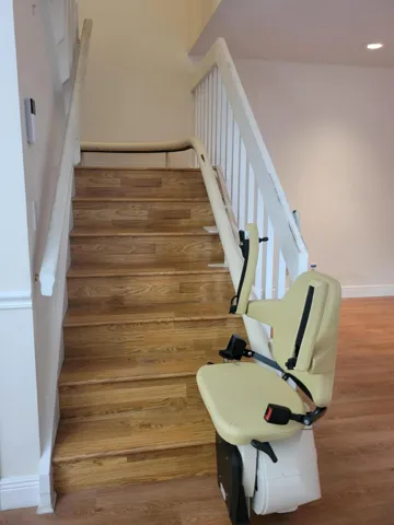This chair lift carries you all the way to the top. Also works for laundry and bags of trash too when not carrying a person up and down.