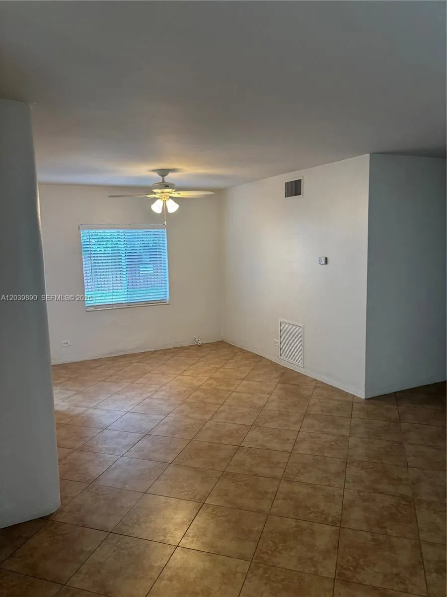 Dining area flowing into living are with door to