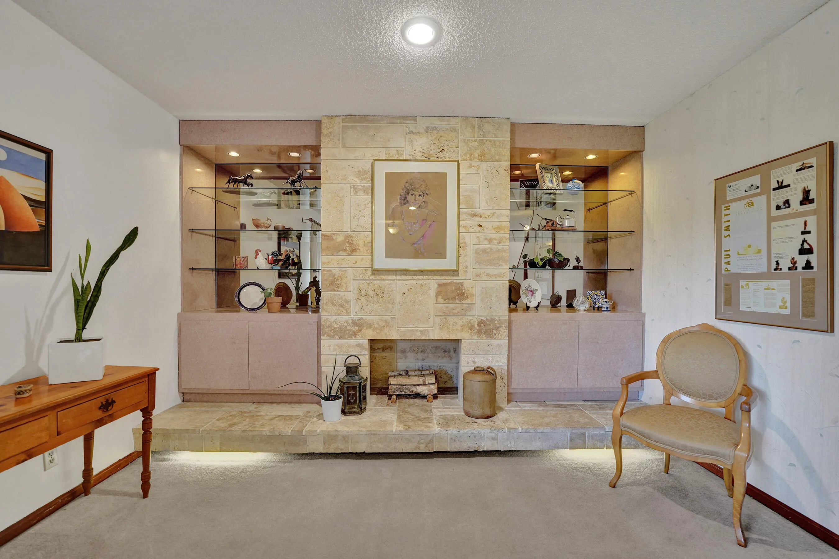 Striking Limestone Fireplace with Built-Ins