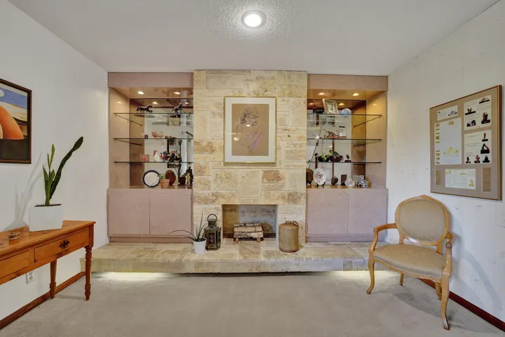 Striking Limestone Fireplace with Built-Ins
