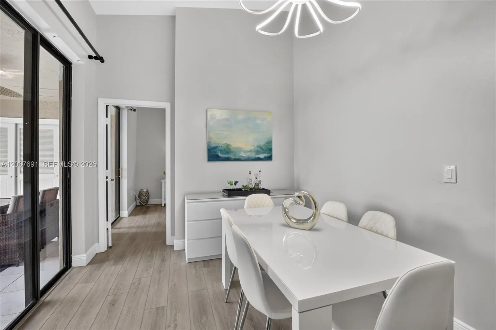 Whether enjoying a quiet breakfast or gathering with friends for dinner, this inviting dining space offers the perfect blend of openness, elegance and connection to the outdoors