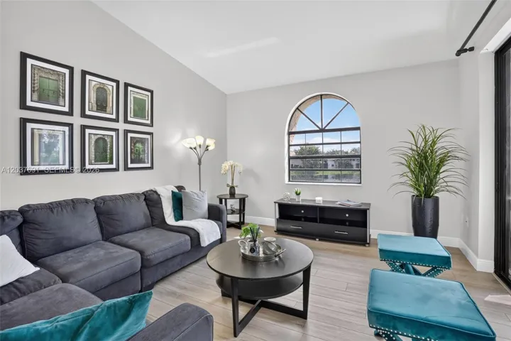 Spacious living room offers an airy open feel, abundant natural light and serene water views
