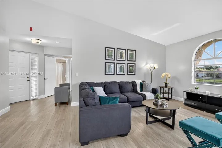 Open-concept living space blends modern updates, natural light and serene lakefront scenery