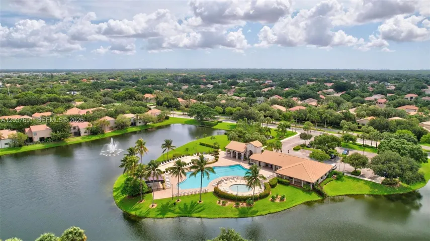 Resort-style amenities include a heated pool, spa, clubhouse and picturesque lakefront setting