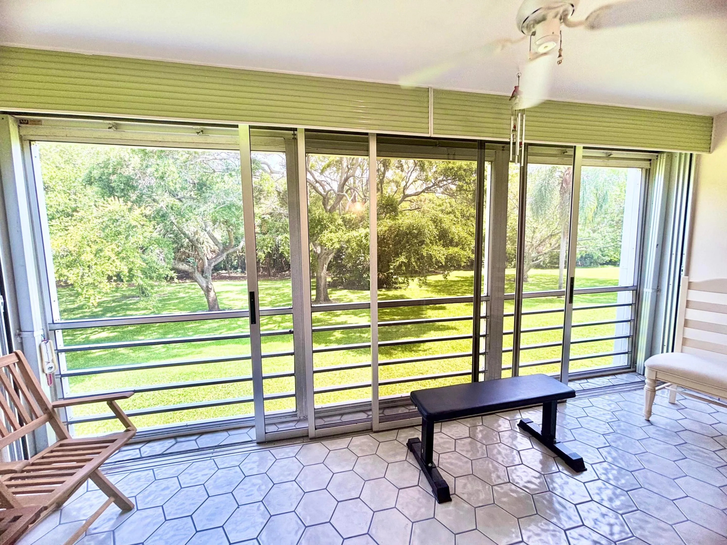Patio area features ceramic tile, floor to ceiling sliding doors