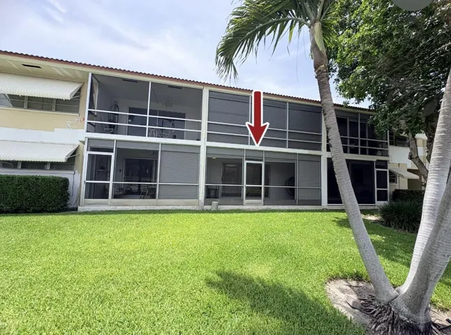 Backyard view of Condo with Arrow