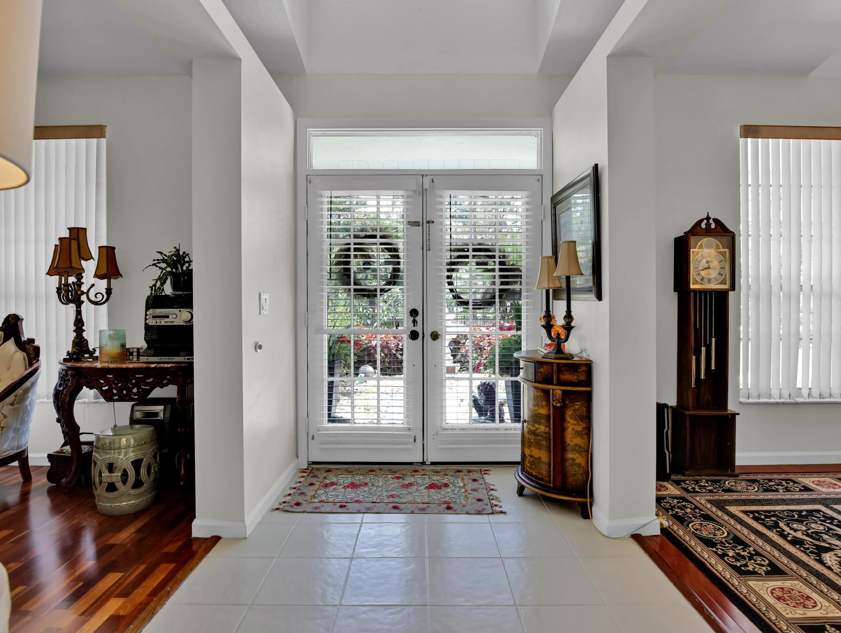 Beautiful double door front entryway with high ceiling and dormers. Brings in lots of natural light.