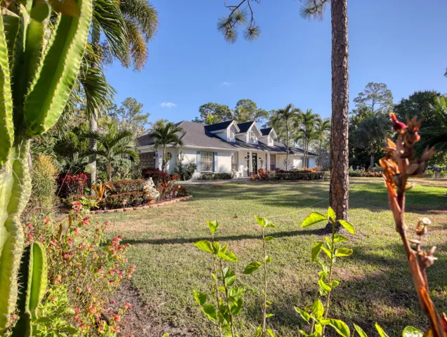 Front yard with beautiful flowers and foliage.