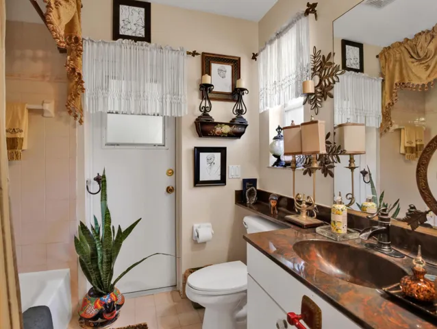 The 2nd bathroom is a cabana bathroom that has an exit door to the patio. Drop in a swimming pool and you already have a bathroom to the outside.