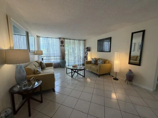 Spacious & Bright Livingroom with Double Sliders to Screened Porch.