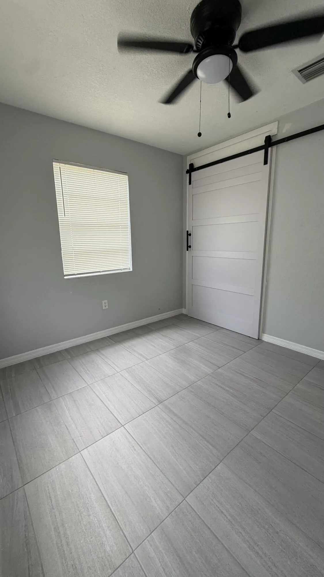 Second Bedroom with a beautiful closet barn door