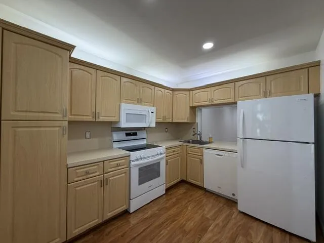 Kitchen with brand new stove and fridge