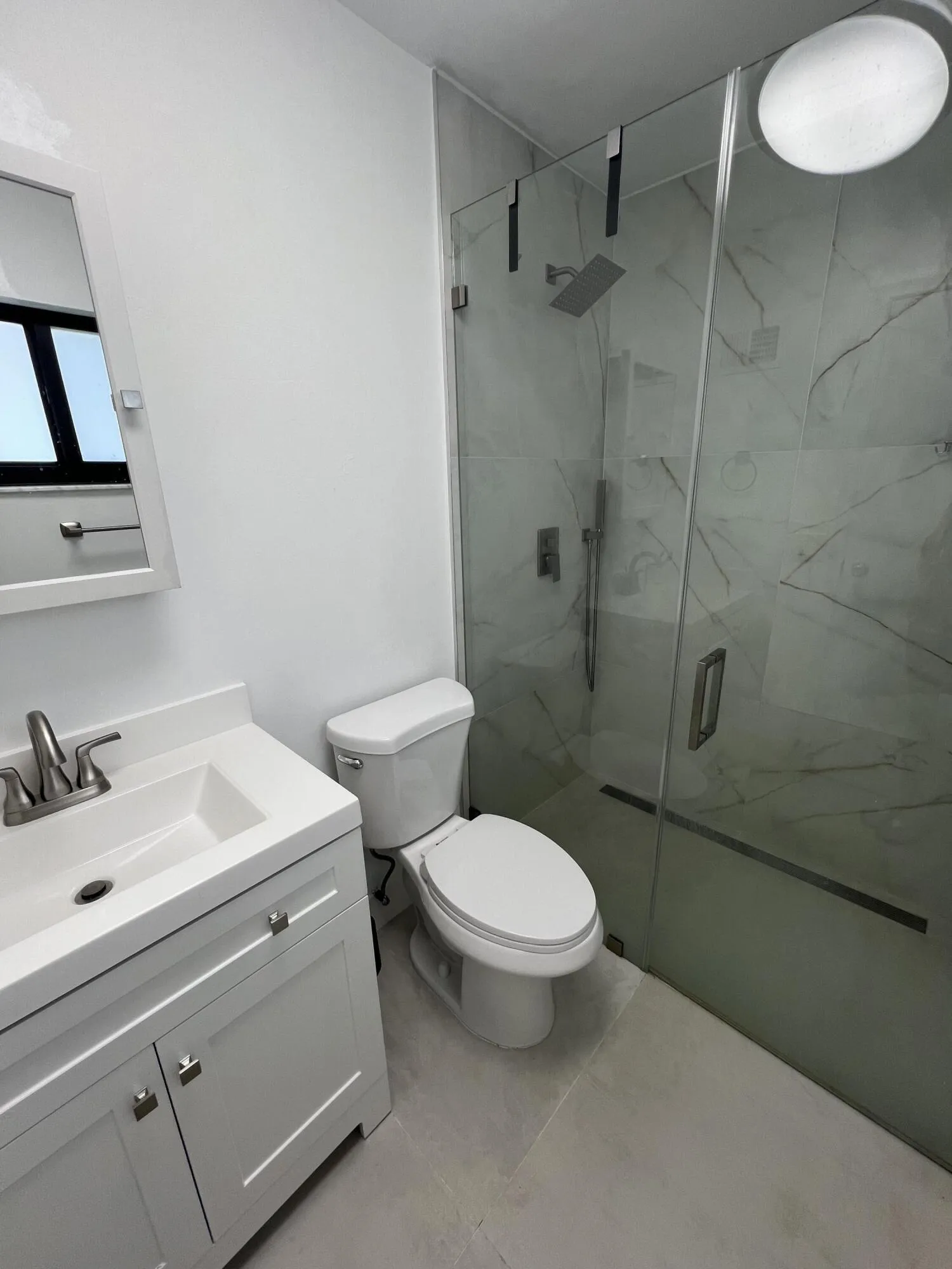 Primary bath, shower only. Glass doors.
