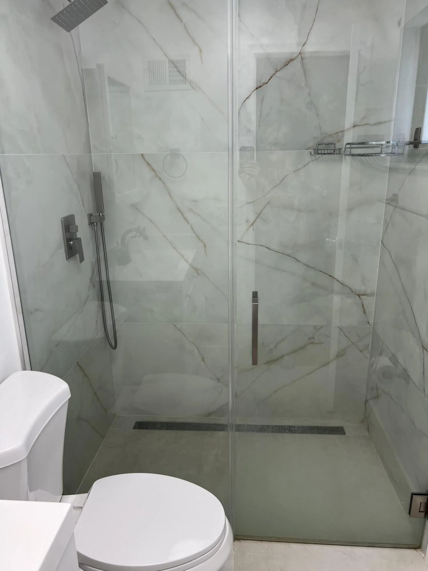 Primary Bath with glass doors. Bright and light.