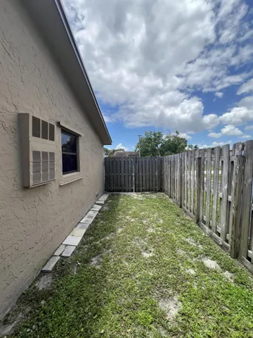 Side Yard, Garage window has panels for protection