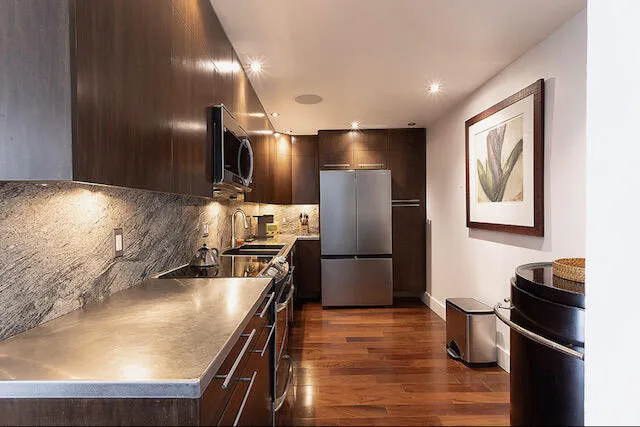 Updated with wood cabinetry, custom lighting, new Samsung refrigerator