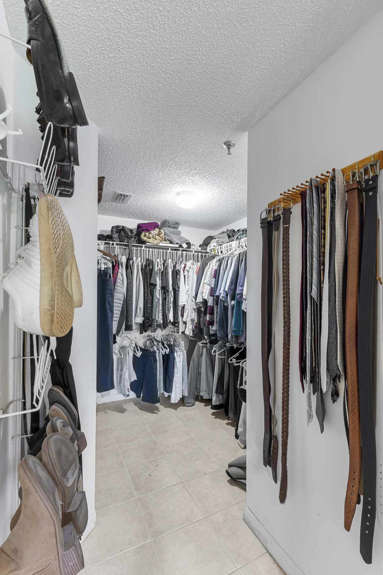 Walk in closet in primary bedroom