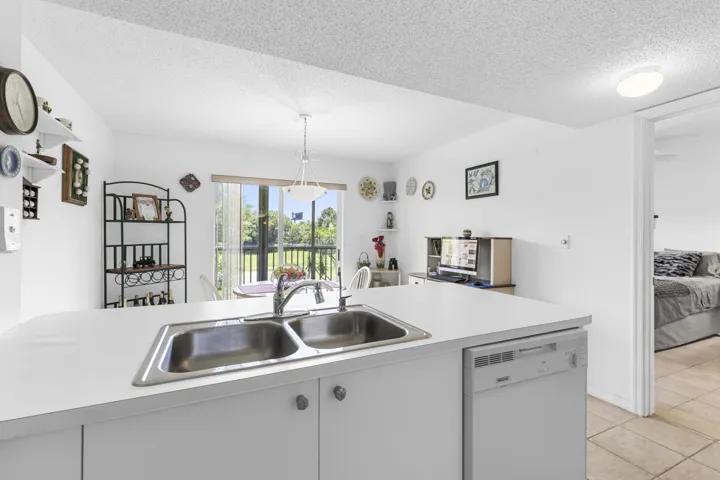 Kitchen opens up to eat-in dining (or office nook) w/ views of golf