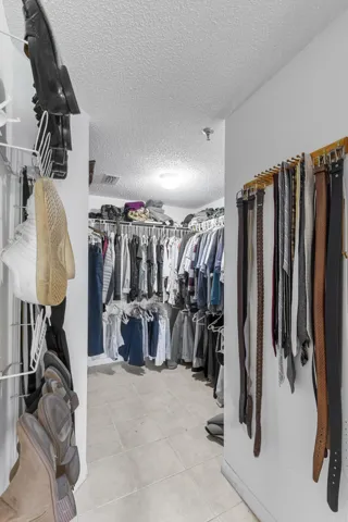 Walk in closet in primary bedroom