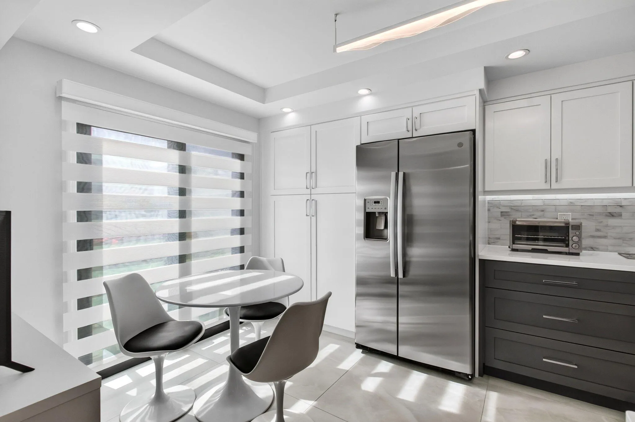 with built in pantry next to refrigerator