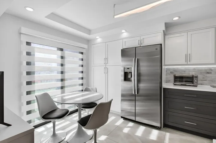 with built in pantry next to refrigerator