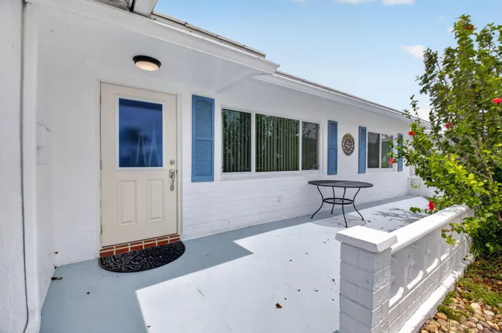 Driveway, garage, front entry, and front lanai