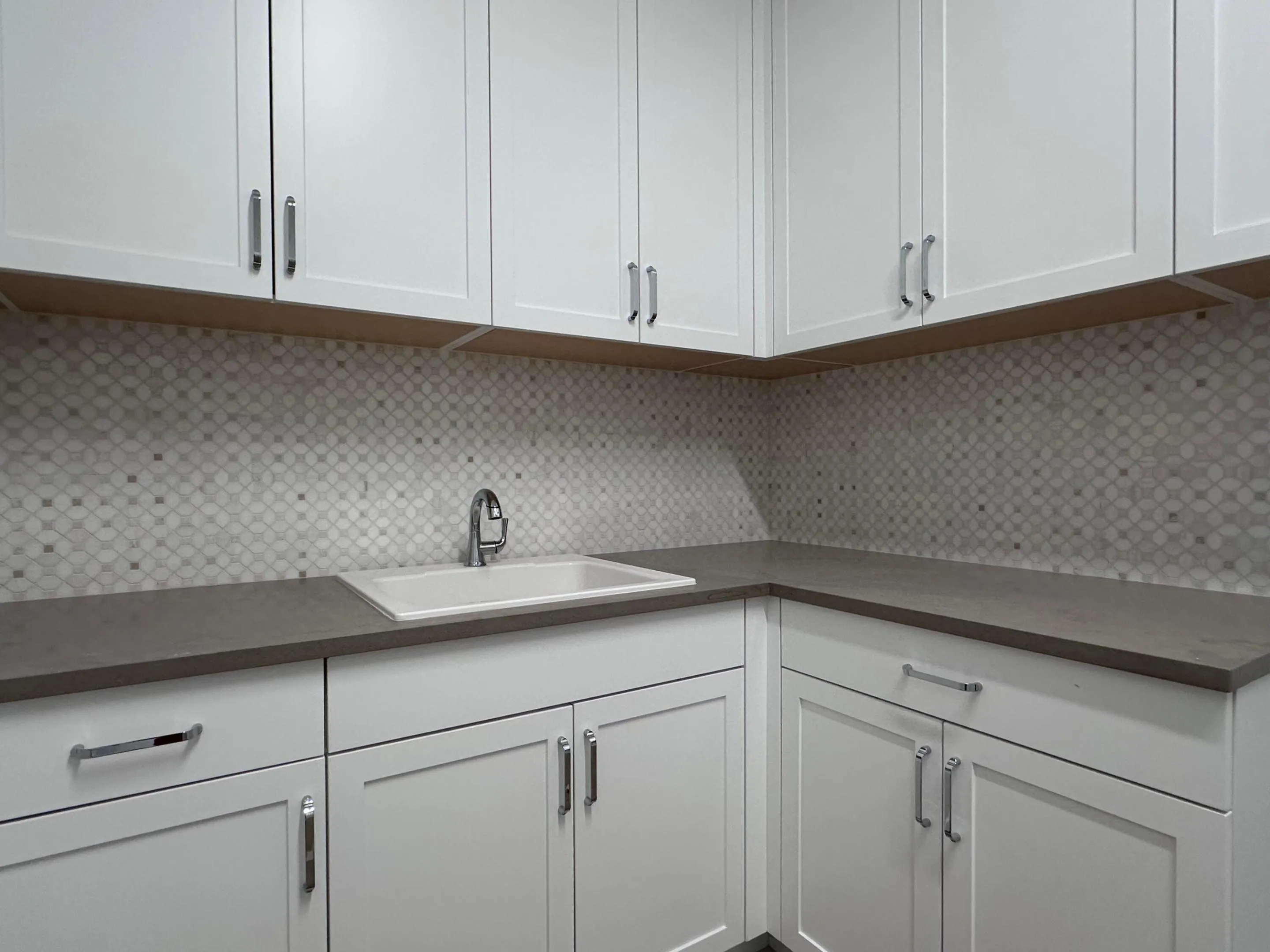 Beautiful mosaic Backsplash in 1st Floor Laundry Room