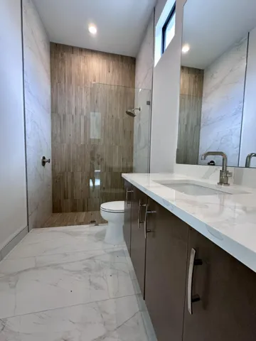 Cabana Bath with Beautiful decorative Feature Wall inside shower