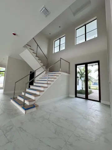 Dramatic 2-story Foyer entry with 10' Glass doors!