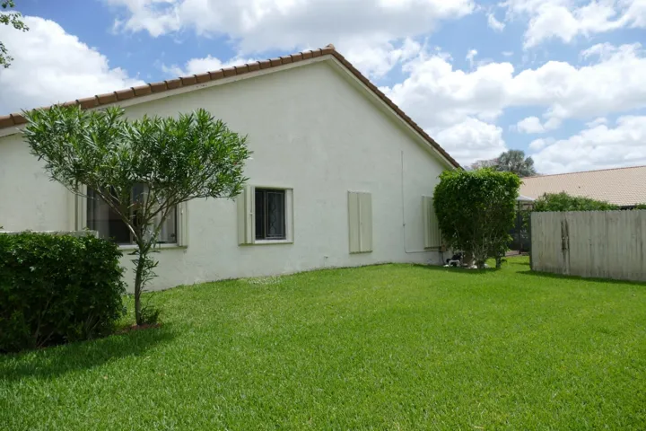 Side yard with privacy fence (not fully enclosed); corner lot