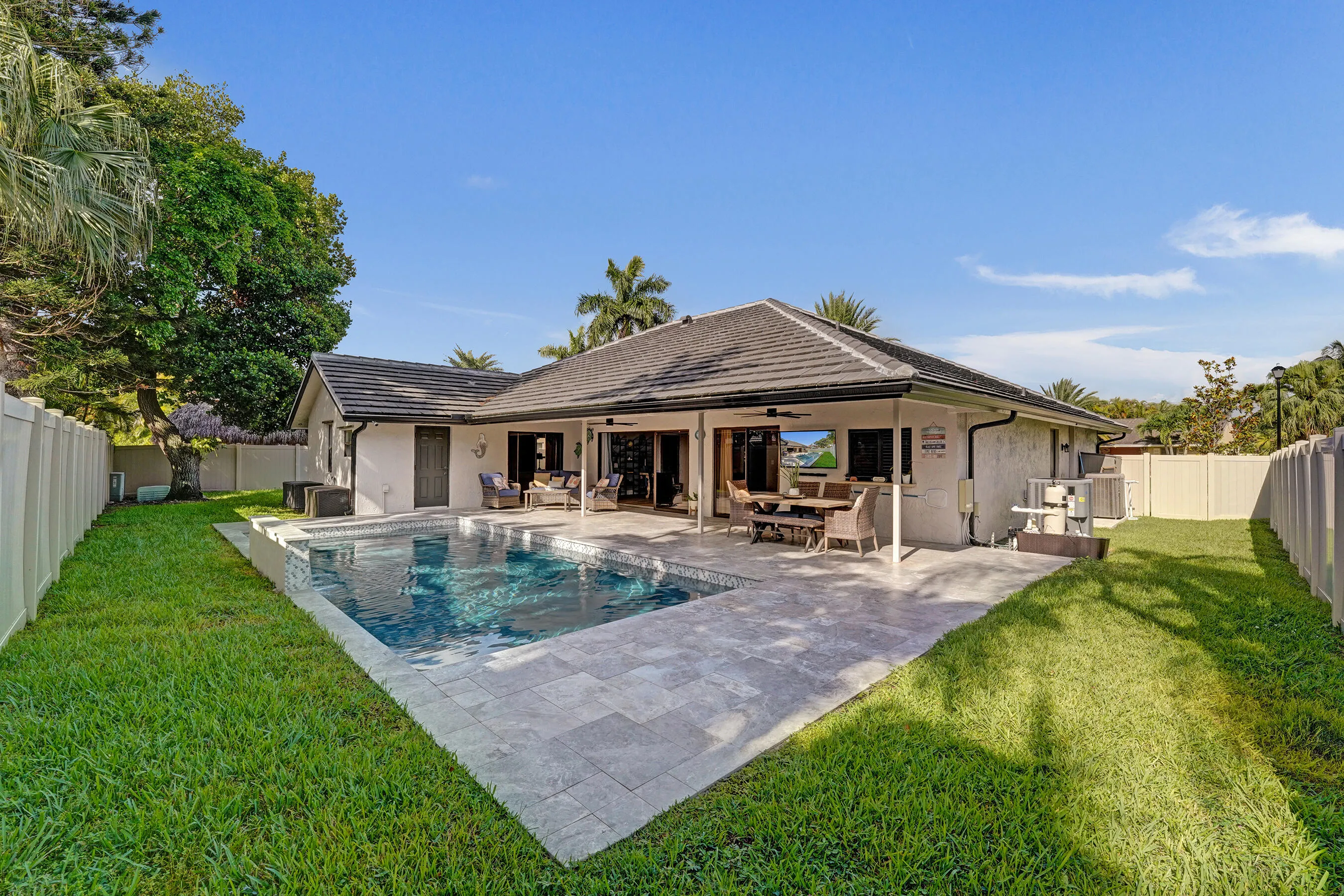 New modern heated pool with water feature, additional hidden yard on each side.